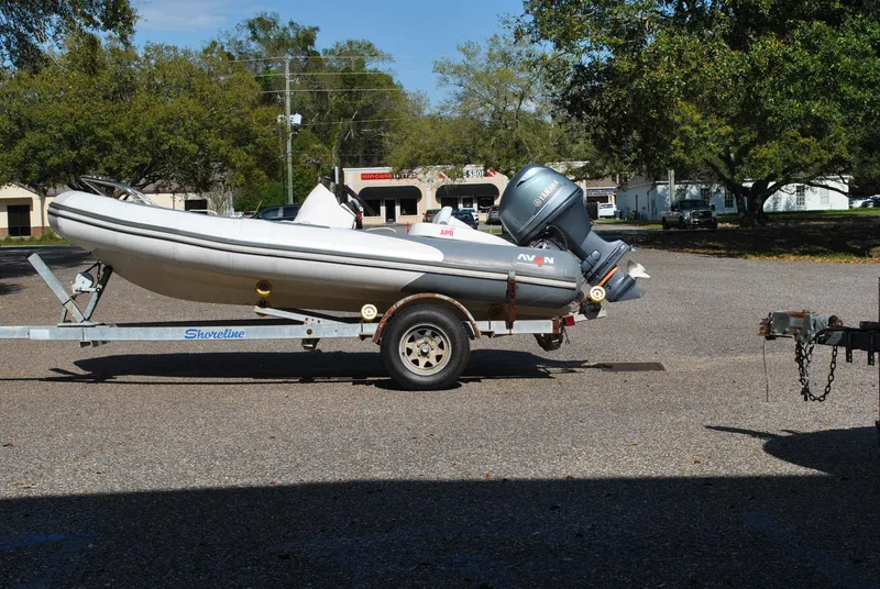 Slide: The Image of 2017 Avon Seasport 340 Deluxe boat on trailer in parking lot. - 1