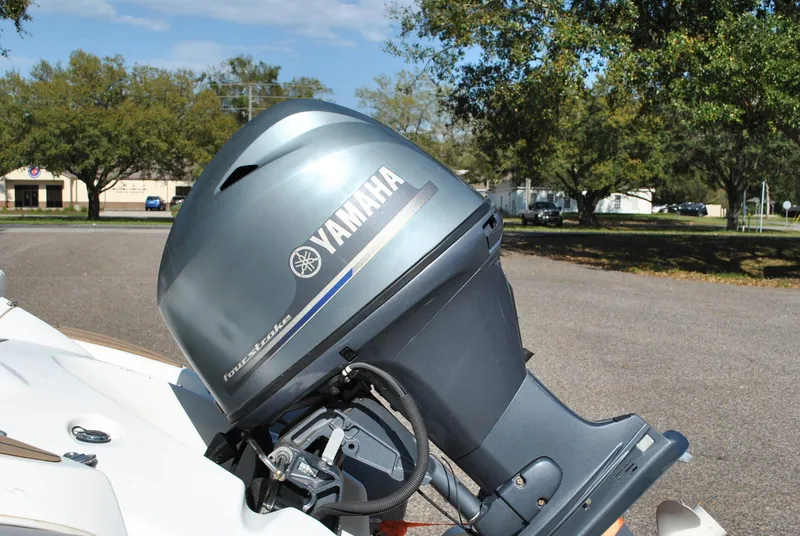 Slide: The Image of 2017 Avon Seasport 340 Deluxe with Yamaha outboard motor in a sunny outdoor setting. - 13