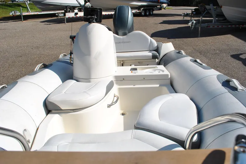 Slide: The Image of 2017 Avon Seasport 340 Deluxe inflatable boat with white seating and console. - 14