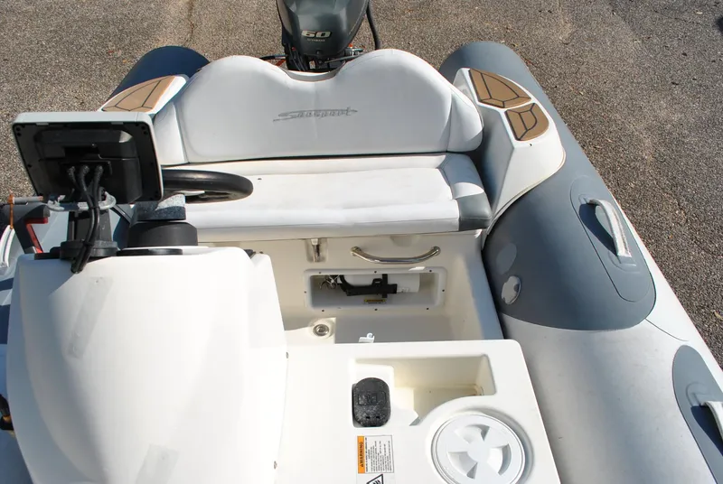 Slide: The Image of 2017 Avon Seasport 340 Deluxe boat interior with steering console and seating. - 19