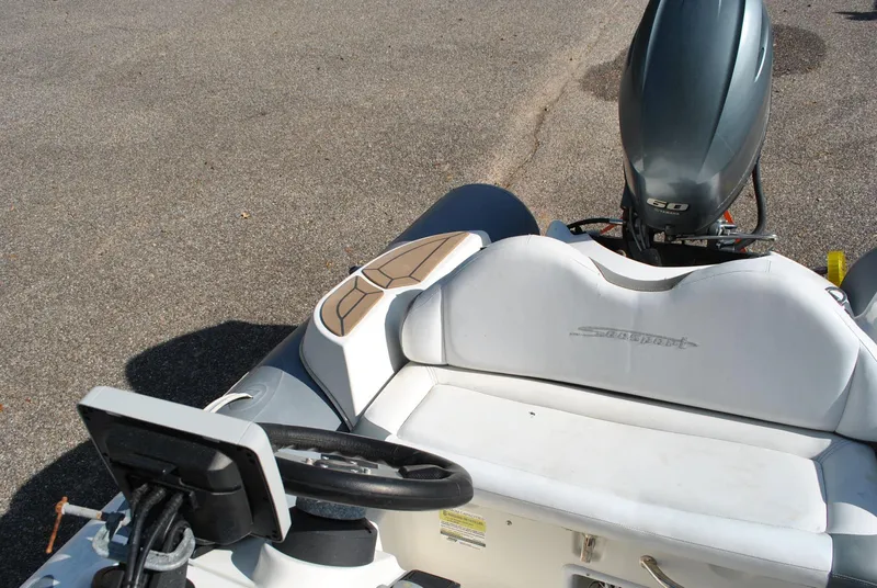 Slide: The Image of 2017 Avon Seasport 340 Deluxe boat interior with steering wheel and outboard motor. - 21