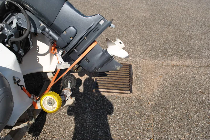 Slide: The Image of 2017 Avon Seasport 340 Deluxe boat engine and propeller on pavement. - 24