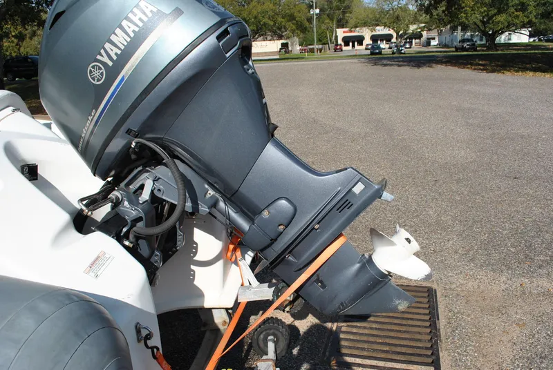 Slide: The Image of 2017 Avon Seasport 340 Deluxe with Yamaha outboard motor, parked on a trailer. - 25