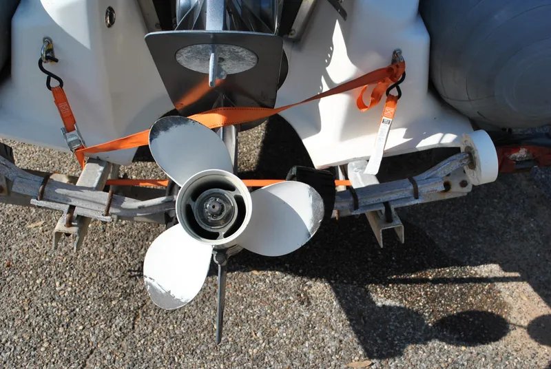Slide: The Image of 2017 Avon Seasport 340 Deluxe boat propeller secured with orange straps on a trailer. - 26