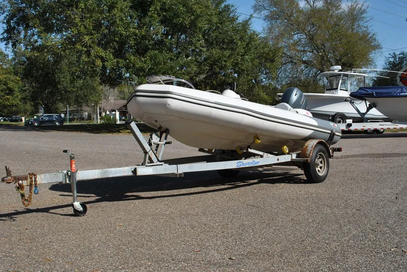 Slide: The Image of 2017 Avon Seasport 340 Deluxe boat on trailer in outdoor setting. - 3