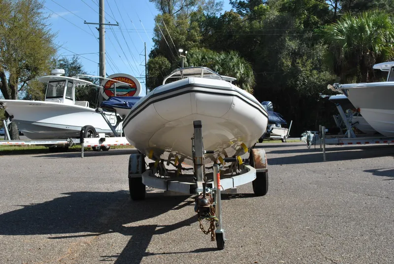 Slide: The Image of 2017 Avon Seasport 340 Deluxe boat on trailer, parked outdoors. - 4
