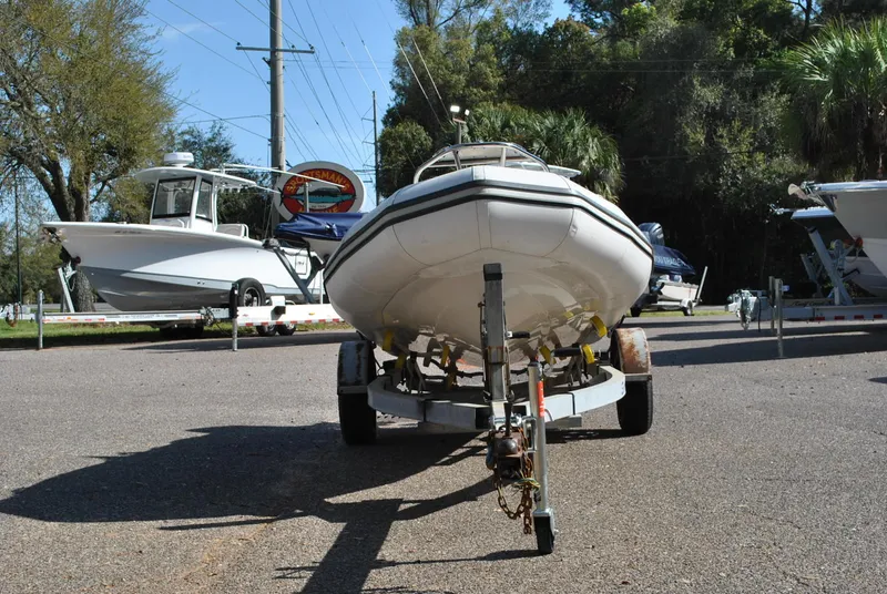 Slide: The Image of 2017 Avon Seasport 340 Deluxe boat on trailer in outdoor setting. - 5