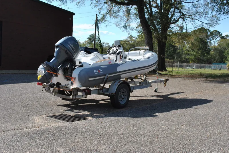 Slide: The Image of 2017 Avon Seasport 340 Deluxe boat on trailer, parked outdoors. - 8