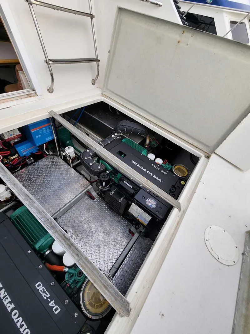 Slide: The Image of Engine compartment of 1991 Wellcraft Triumph 34 boat, featuring Volvo Penta components. - 15