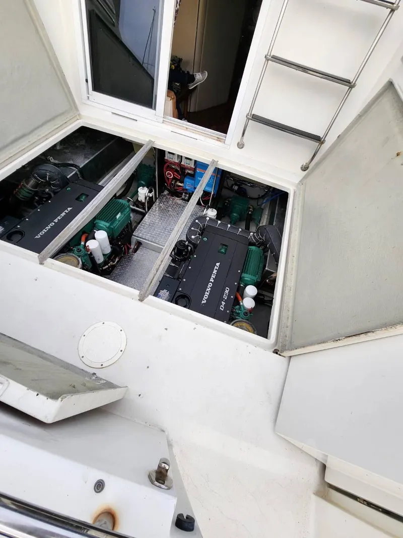 Slide: The Image of Engine compartment of 1991 Wellcraft Triumph 34 boat, showcasing dual engines. - 9