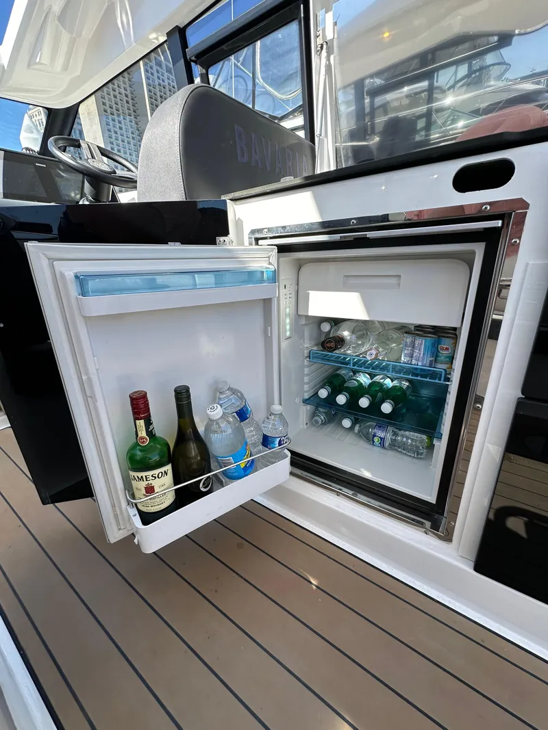 Slide: The Image of Mini fridge on Bavaria SR36 yacht, stocked with beverages, 2023 model. - 30