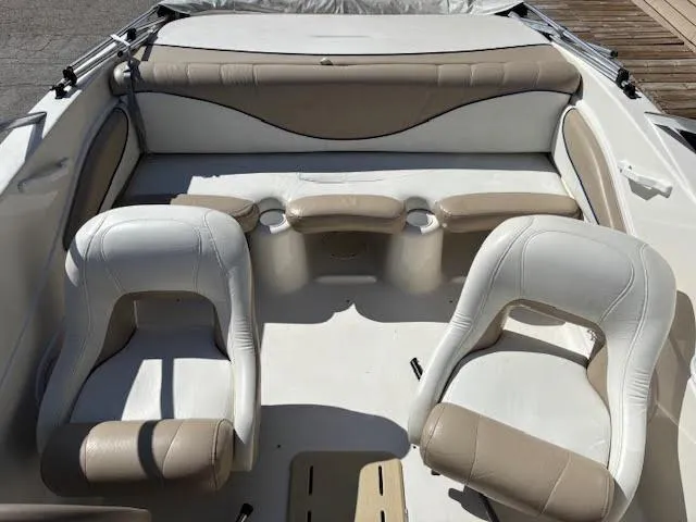 Slide: The Image of 2005 Glastron MX 175 boat interior with beige and white seating. - 10