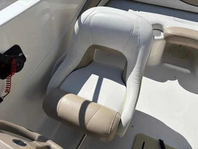 Slide: The Image of 2005 Glastron MX 175 boat seat, white and beige upholstery, interior view. - 13