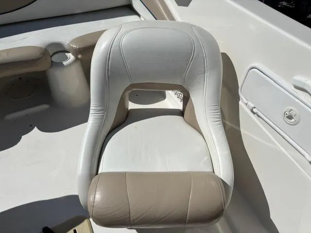 Slide: The Image of Boat seat in a 2005 Glastron MX 175, featuring beige and white upholstery. - 14