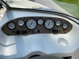 Slide: The Image of Dashboard of 2005 Glastron MX 175 boat with gauges and controls. - 17