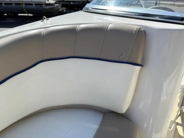 Slide: The Image of 2005 Glastron MX 175 boat interior with beige and white seating. - 20