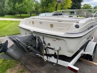 Slide: The Image of 2005 Glastron MX 175 boat on trailer, parked outdoors. - 7