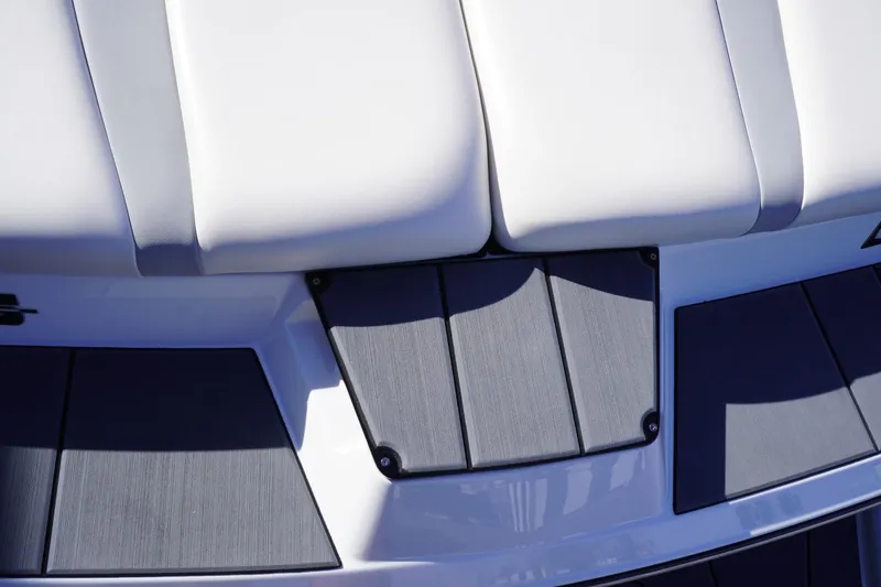 Slide: The Image of 2019 Axis A22 boat deck with white seating and gray flooring. - 15