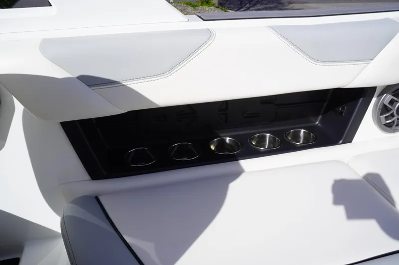 Slide: The Image of 2019 Axis A22 boat interior with cup holders and speaker. - 20