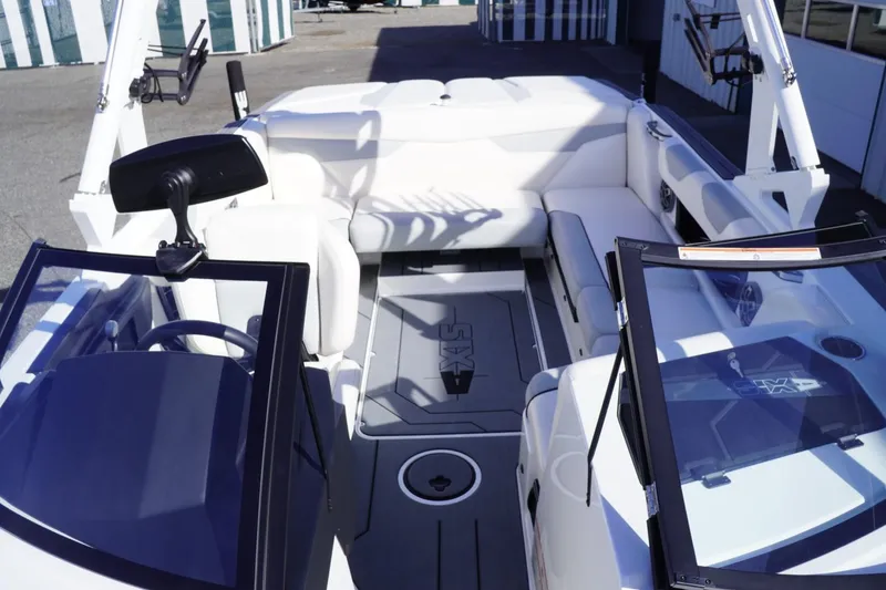 Slide: The Image of 2019 Axis A22 boat interior with white seating and open cockpit design. - 26