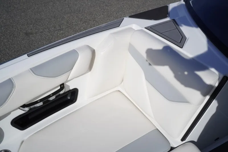 Slide: The Image of 2019 Axis A22 boat interior with white and gray seating, showing sleek design and modern features. - 27