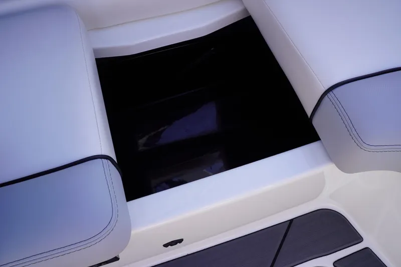 Slide: The Image of 2019 Axis A22 boat interior storage compartment with cushioned seating. - 37