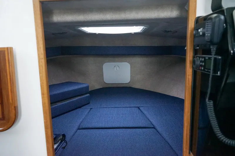 Slide: The Image of Interior cabin of 2025 Sea Sport 26' Aleutian boat with blue upholstery. - 10