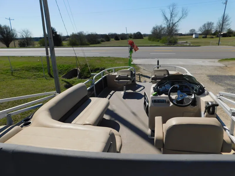 Slide: The Image of 2017 Sun Tracker Fishin' Barge 22 XP3 pontoon boat with spacious seating and steering console. - 5