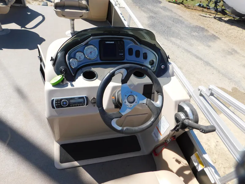 Slide: The Image of 2017 Sun Tracker Fishin' Barge 22 XP3 dashboard with steering wheel and controls. - 6