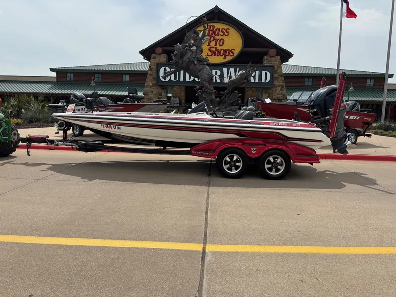 Slide: The Image of 2012 Skeeter FX21 boat parked outside Bass Pro Shops Outdoor World. - 1
