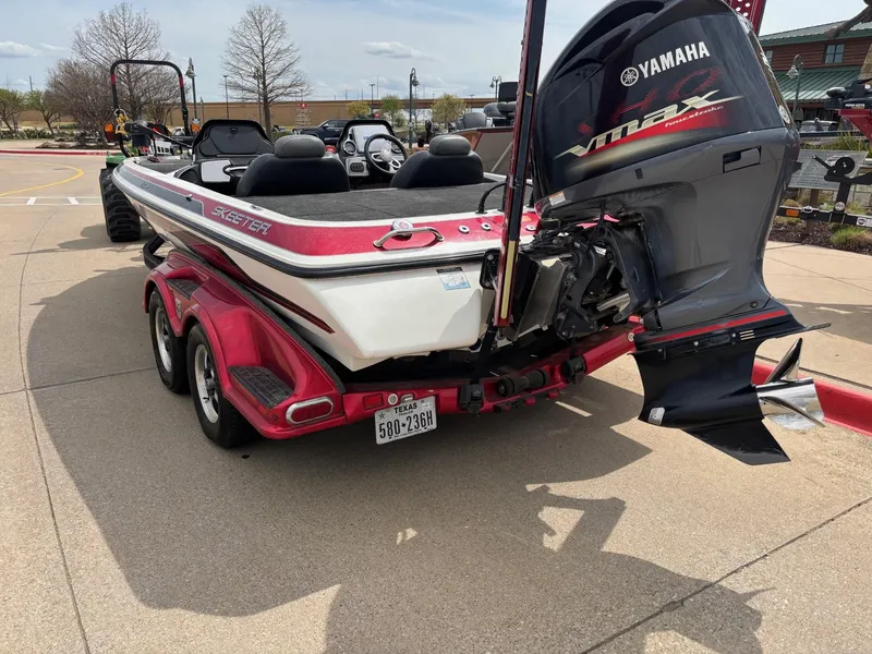 Slide: The Image of 2012 Skeeter FX21 boat with Yamaha engine on a red trailer. - 3
