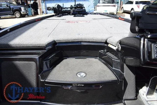 Slide: The Image of 2024 Ikon Boats LX21 deck with storage compartments and marine equipment. - 19