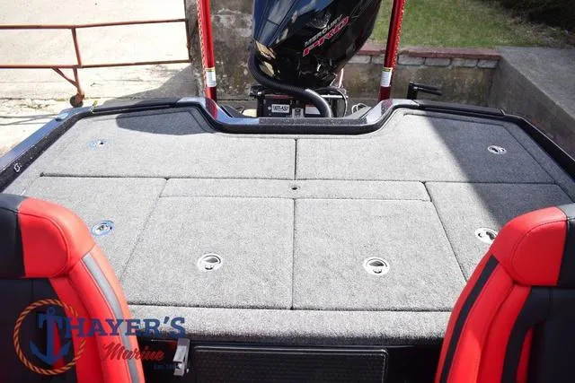 Slide: The Image of 2024 Ikon Boats LX21 rear deck with red seats and motor, at Thayer's Marine. - 27