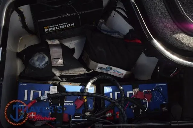 Slide: The Image of Storage compartment of 2024 Ikon Boats LX21 with batteries and equipment. - 32