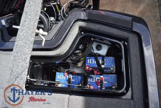 Slide: The Image of 2024 Ikon Boats LX21 battery compartment with ION batteries and wiring. - 33