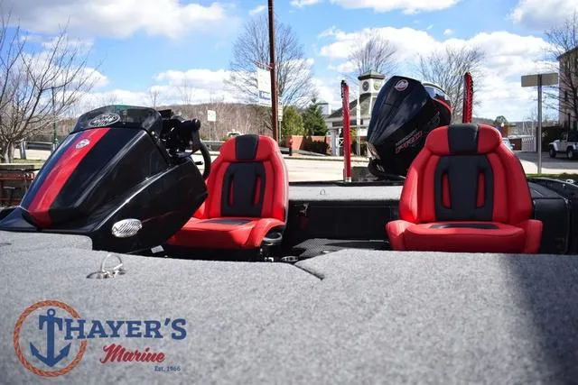 Slide: The Image of 2024 Ikon Boats LX21 with red seats and motor, displayed at Thayer's Marine. - 35