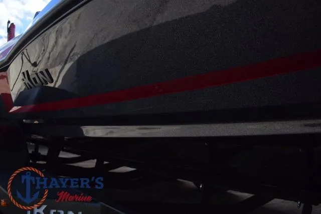 Slide: The Image of 2024 Ikon Boats LX21 with sleek design and red accent stripe, displayed at Thayer's Marine. - 40