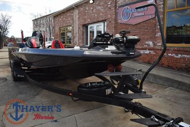 Slide: The Image of 2024 Ikon Boats LX21 on trailer outside Thayer's Marine, showcasing sleek design and modern features. - 8