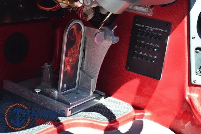 Slide: The Image of Interior of a 2021 Triton 18 TrX boat showing foot pedal and control panel. - 17