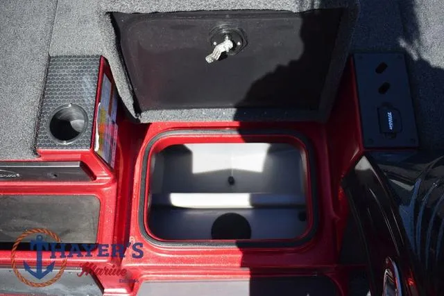 Slide: The Image of Open storage compartment on 2021 Triton 18 TrX boat deck. - 19
