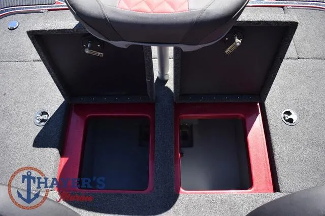 Slide: The Image of 2021 Triton 18 TrX boat storage compartments with open lids, featuring red interior accents. - 25