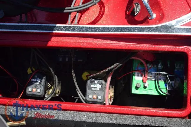 Slide: The Image of Battery compartment of 2021 Triton 18 TrX boat with wiring and chargers. - 29
