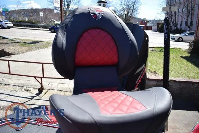 Slide: The Image of 2021 Triton 18 TrX boat seat with red and black diamond pattern upholstery. - 30