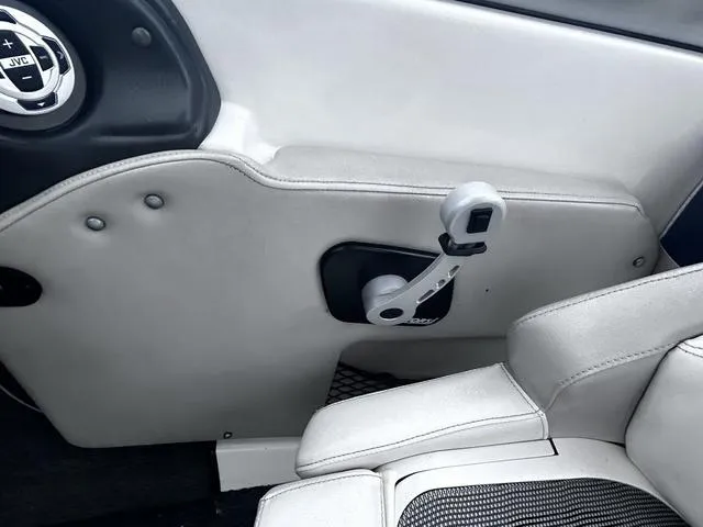 Slide: The Image of Interior of 2008 Tigé 24 VE boat, featuring control lever and JVC audio system. - 11