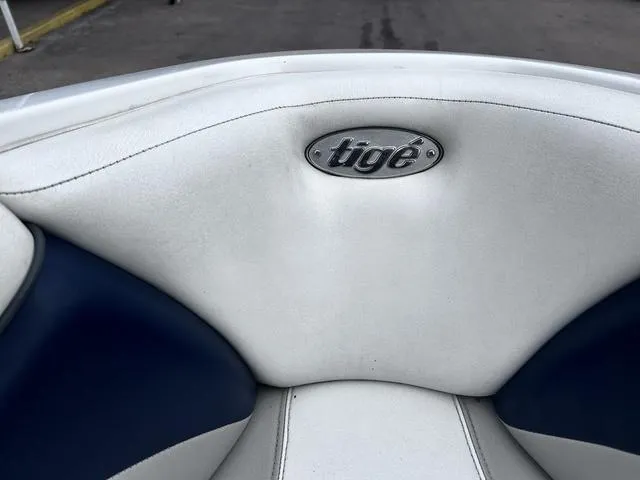 Slide: The Image of 2008 Tigé 24 VE boat interior with white and blue upholstery. - 14