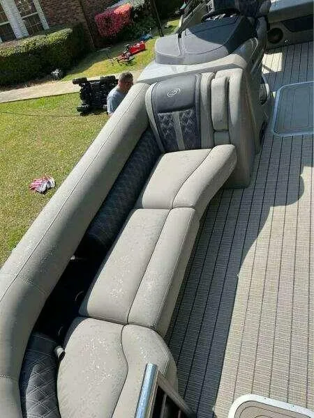 Slide: The Image of 2023 Barletta LUSSO 25U pontoon boat with luxurious seating on deck. - 6