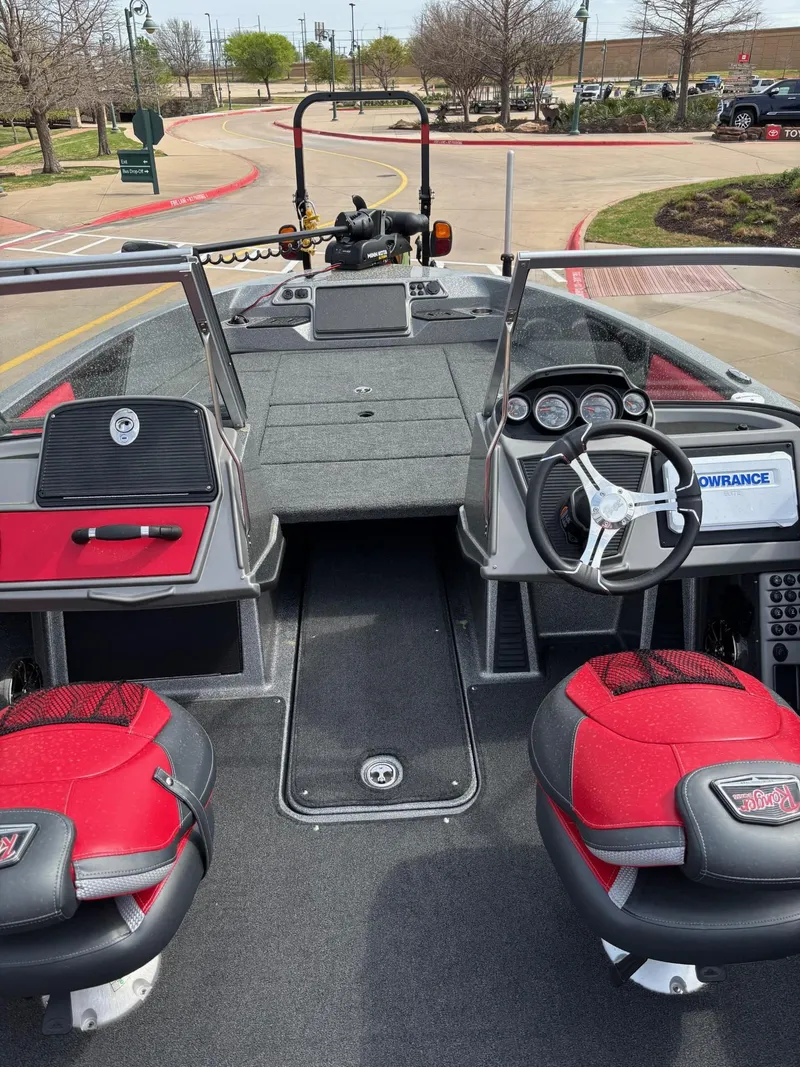 Slide: The Image of 2022 Ranger 2050MS boat interior with red seats and modern dashboard controls. - 5