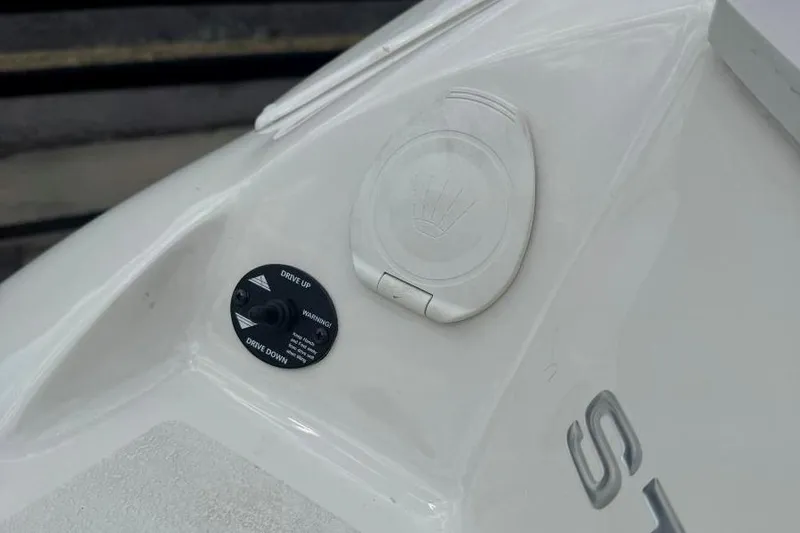 Slide: The Image of Close-up of 2017 Stingray 235 LR boat control panel and emblem. - 11