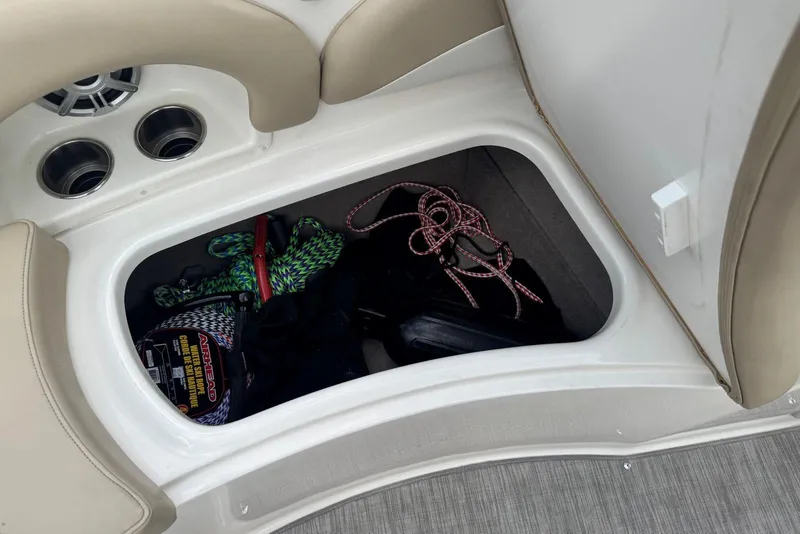 Slide: The Image of Storage compartment in 2017 Stingray 235 LR boat with ropes and equipment. - 34
