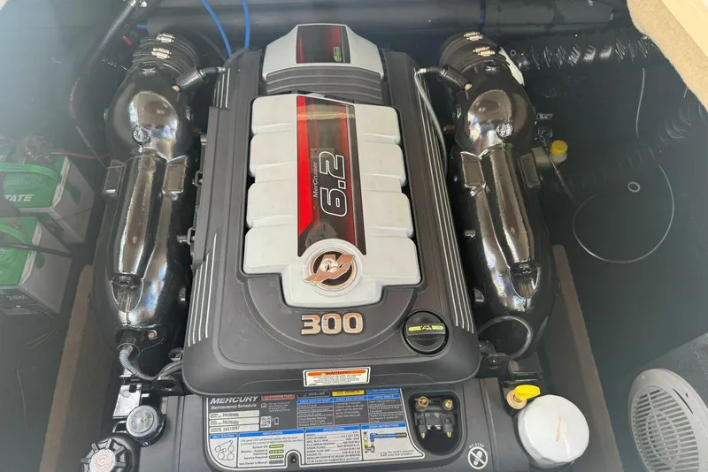Slide: The Image of Engine compartment of a 2017 Stingray 235 LR boat, featuring a 6.2L Mercury engine. - 49